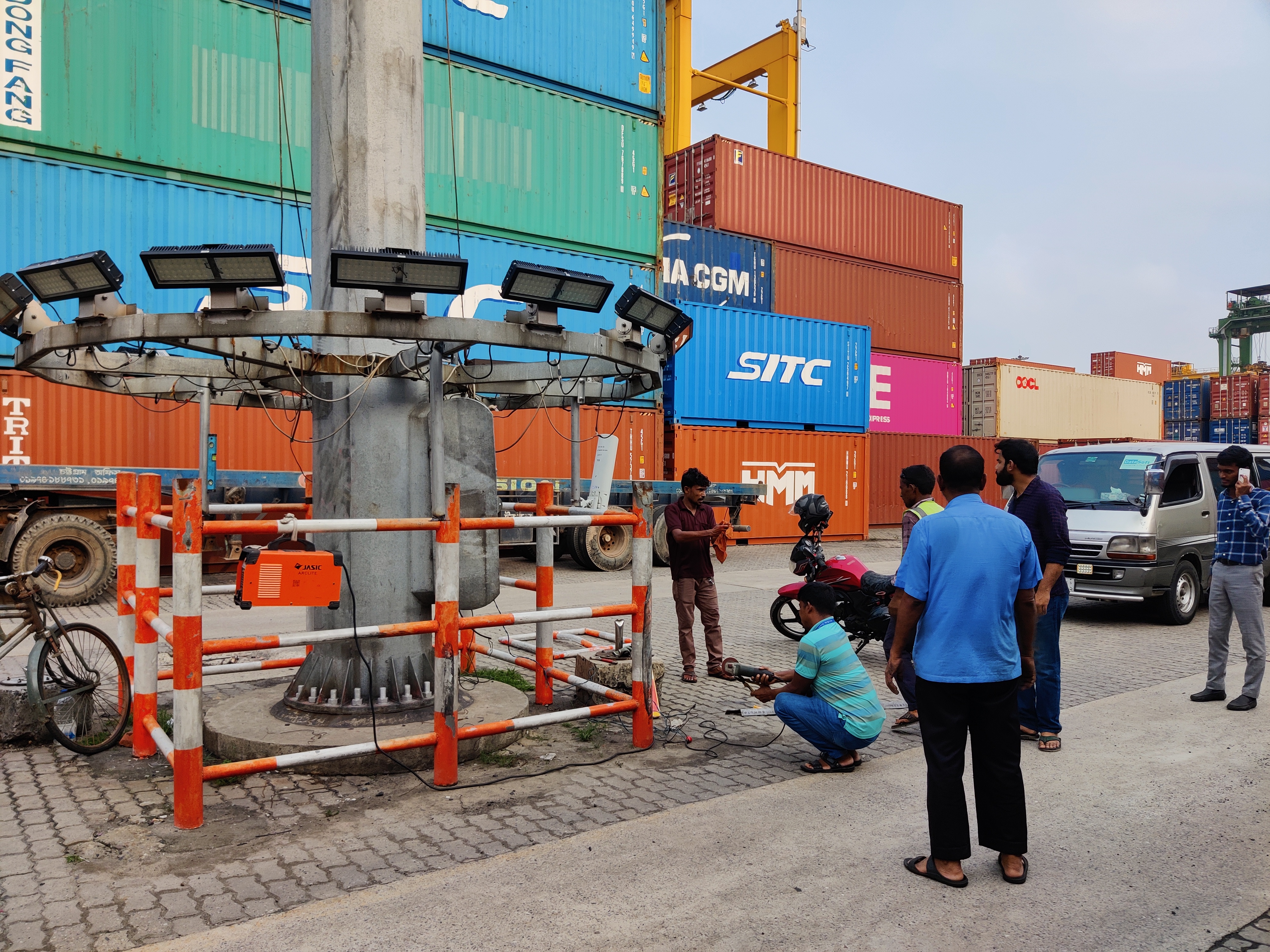 On-site installation work on a pole-mounted lighting and camera array